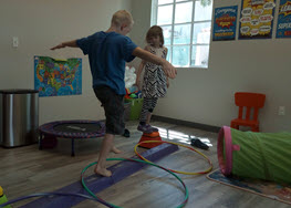 Mother's Day Children on balancing beam.