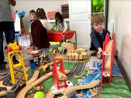 Children playing with toy city at Milestone Family Solutions