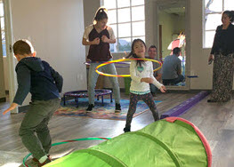 Children playing with hula hoops