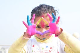 Girl showing painted hands