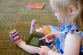 Child reading book.