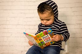 Child reading book.