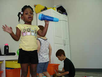 Girl Singing in the Fun Zone