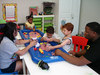 Children playing with sensory sand